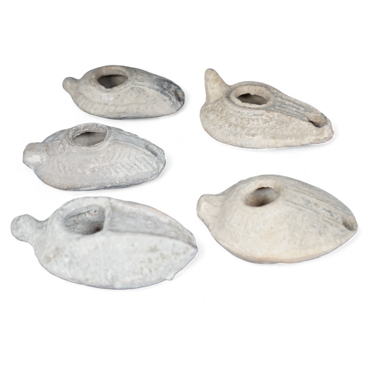 Five Roman terracotta oil lamps, 3rd century. Condition - poor to fair